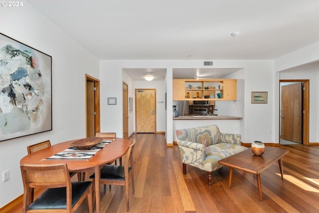 dining room featuring wood-type flooring