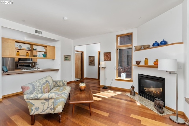 living room with light hardwood / wood-style flooring