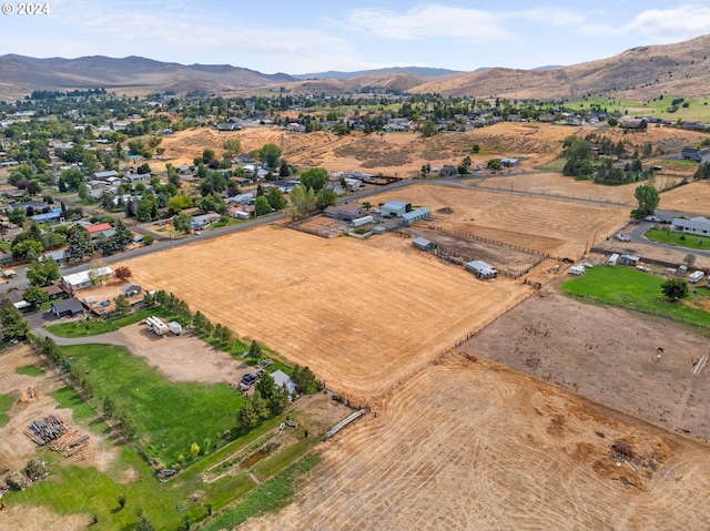 birds eye view of property featuring a mountain view and a rural view