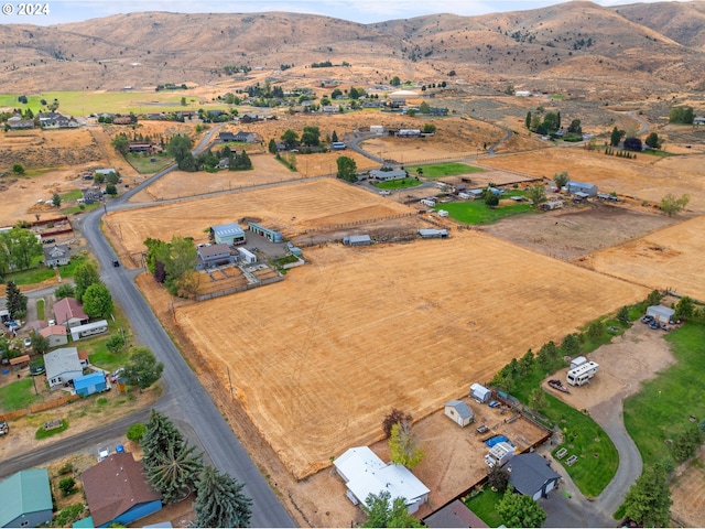 birds eye view of property featuring a mountain view and a rural view