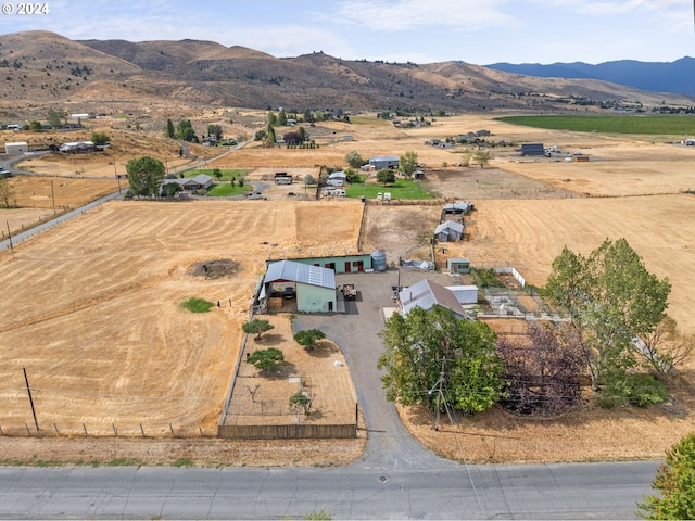 drone / aerial view featuring a mountain view and a rural view