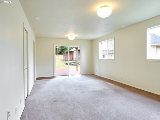 328 Mill St, Silverton, OR 97381 - carpeted empty room featuring plenty of natural light and baseboards