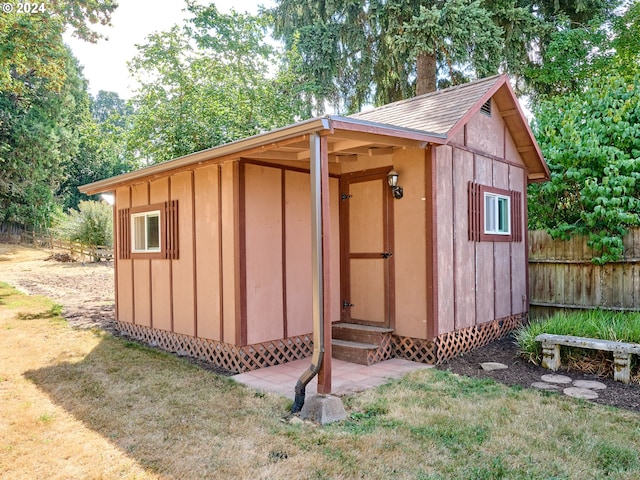 view of outdoor structure with a lawn