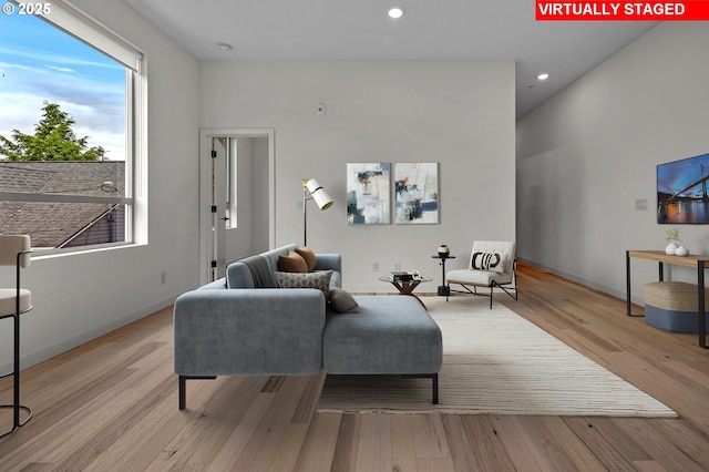 6610 N Greenwich Ave Unit 5, Portland, OR 97217 - living room featuring wood finished floors, recessed lighting, and baseboards