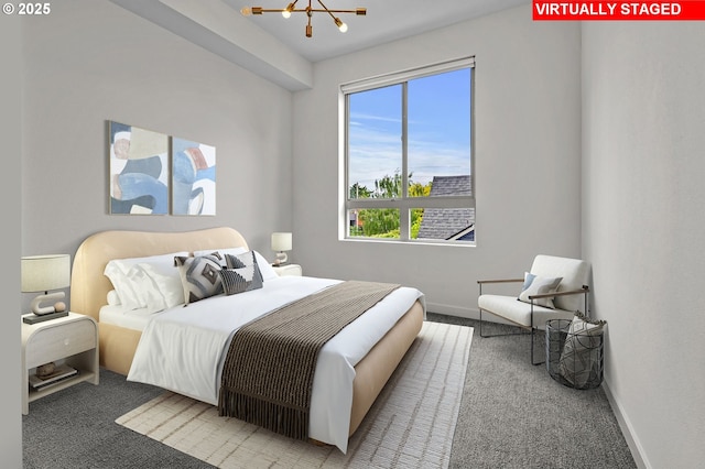 6610 N Greenwich Ave Unit 5, Portland, OR 97217 - carpeted bedroom featuring a chandelier and baseboards