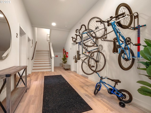 workout room with light hardwood / wood-style flooring