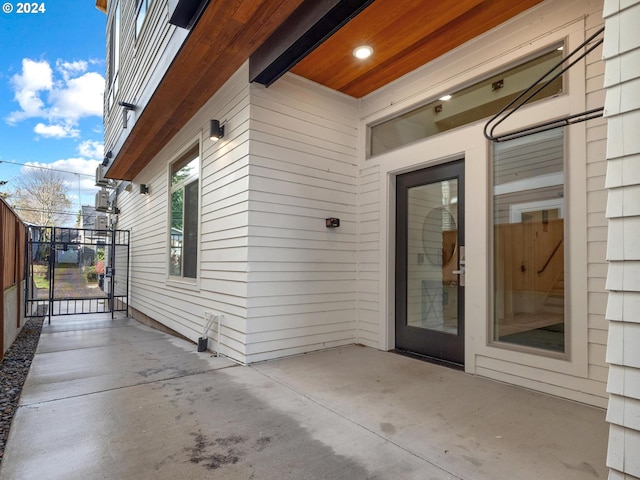 entrance to property featuring a patio area