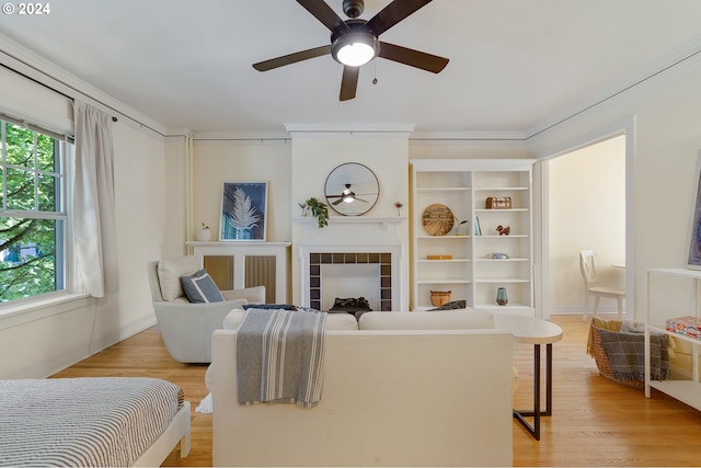 interior space with ceiling fan, light hardwood / wood-style flooring, and a healthy amount of sunlight