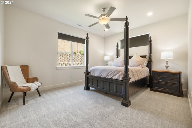 bedroom featuring ceiling fan and light colored carpet