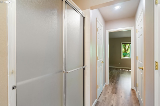 corridor featuring light hardwood / wood-style floors