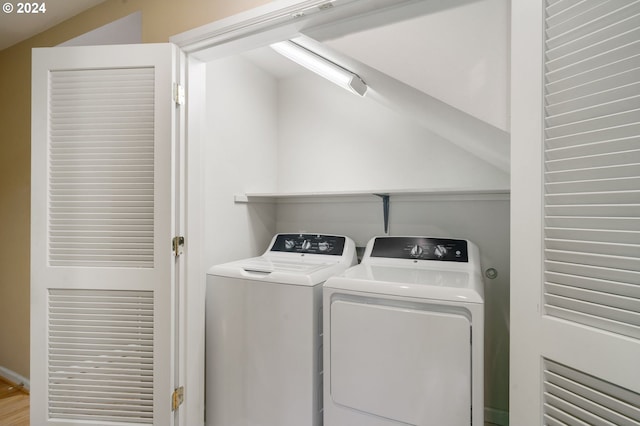 clothes washing area featuring washing machine and dryer