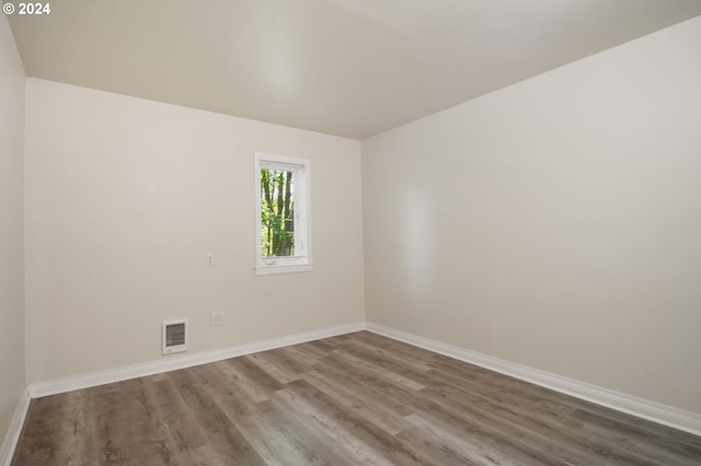 unfurnished room featuring hardwood / wood-style floors