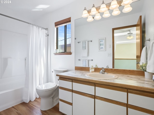 full bathroom featuring vanity, ceiling fan, shower / bath combo with shower curtain, hardwood / wood-style flooring, and toilet