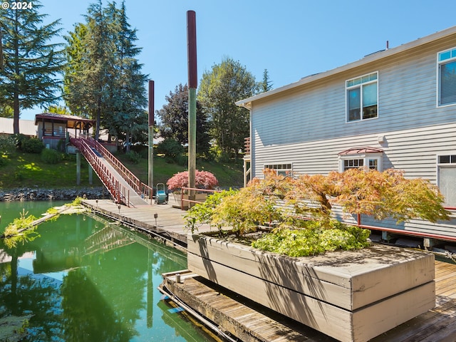 dock area featuring a water view