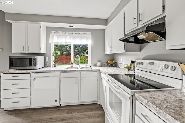 kitchen with white appliances, dark wood-type flooring, sink, and white cabinets