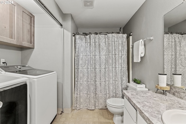 bathroom with vanity, a shower with curtain, toilet, and washing machine and dryer