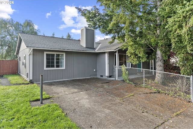 back of house featuring a patio and a yard