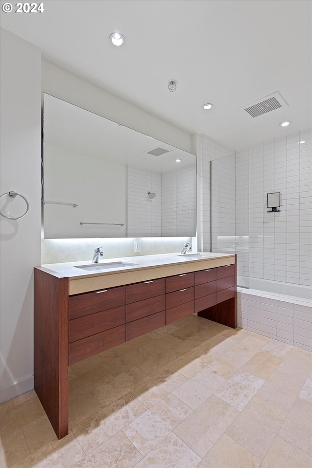 3570 S River Pkwy Unit 1609, Portland, OR 97239 - full bath with double vanity, recessed lighting, and tiled shower / bath combo