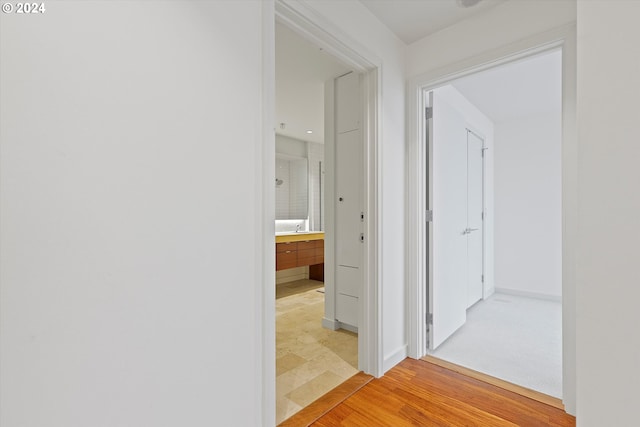 hallway with wood-type flooring