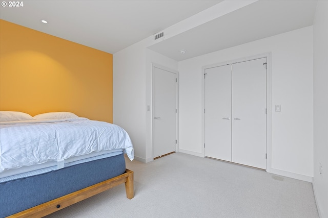 carpeted bedroom featuring a closet