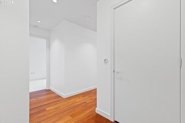 corridor featuring light hardwood / wood-style floors