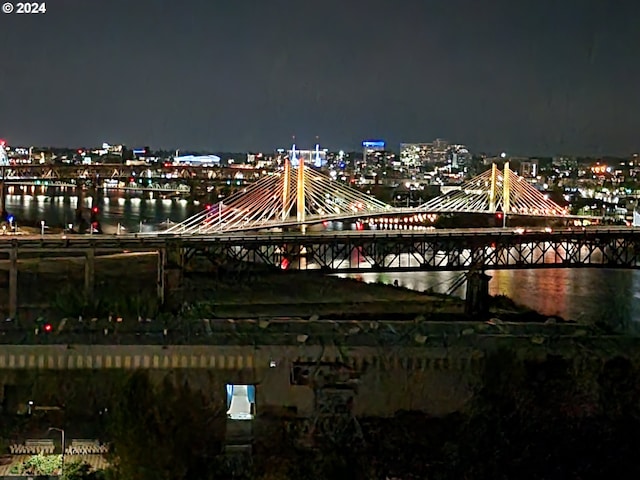 property's view of city featuring a water view