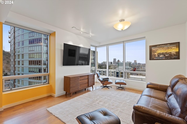 3570 S River Pkwy Unit 1609, Portland, OR 97239 - living room with wood finished floors and track lighting