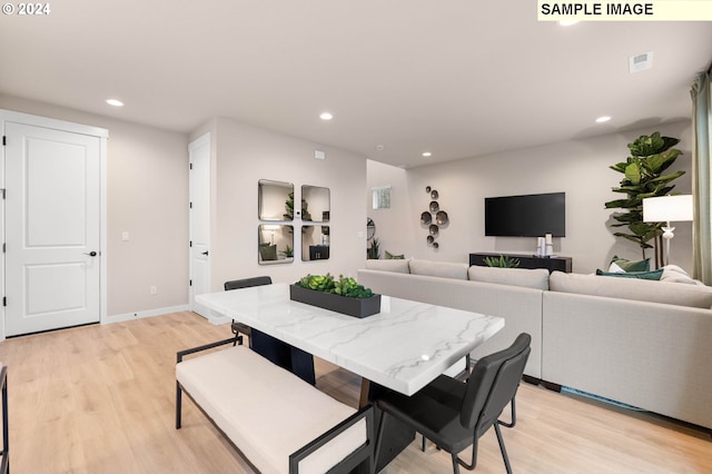 dining room with light hardwood / wood-style flooring