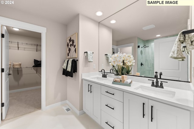 bathroom with vanity and a shower with door