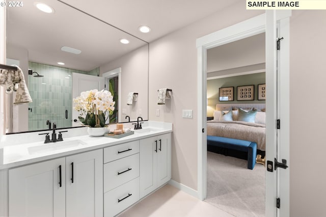 bathroom with vanity and a shower with shower door