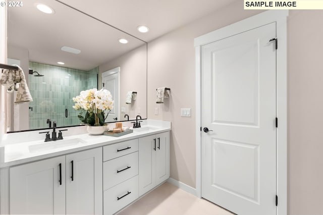 bathroom featuring vanity and a shower with shower door