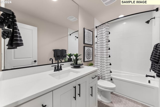 full bathroom featuring tile patterned floors, vanity, toilet, and shower / tub combo with curtain