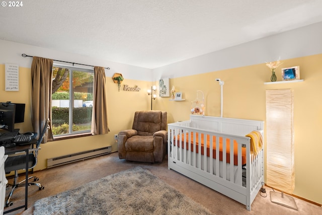 bedroom featuring a nursery area, a textured ceiling, a baseboard radiator, and carpet floors