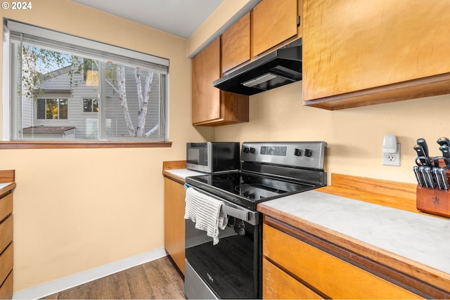 kitchen featuring dark hardwood / wood-style floors and stainless steel appliances