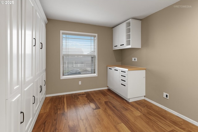 kitchen featuring white cabinets and dark hardwood / wood-style floors