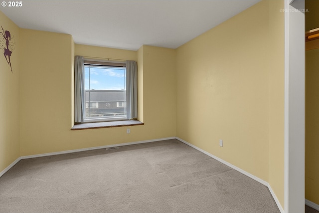 spare room featuring carpet floors