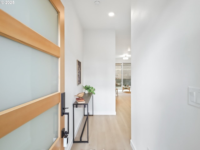 hallway with light wood-type flooring