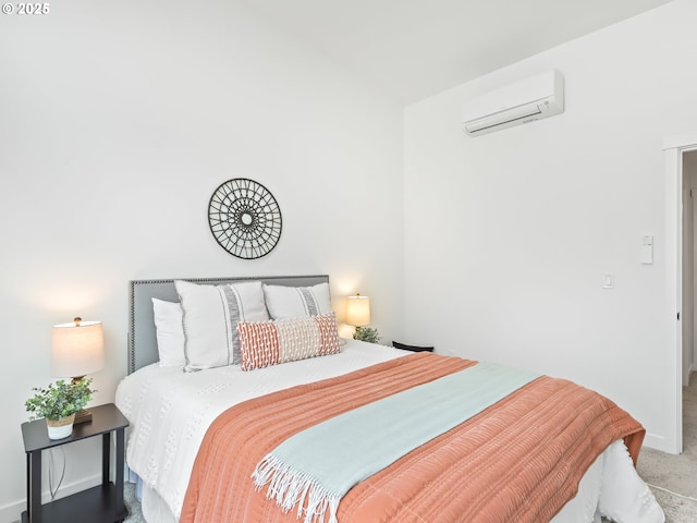 carpeted bedroom featuring a wall unit AC