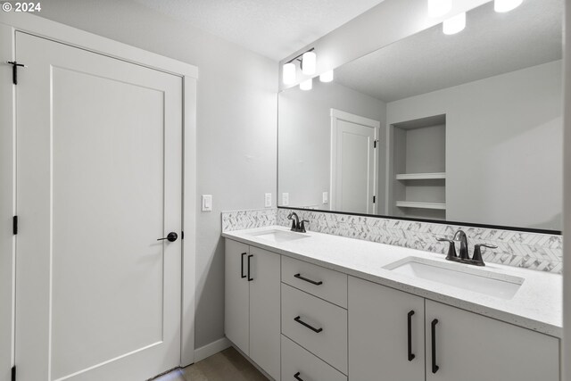 bathroom featuring vanity and a textured ceiling