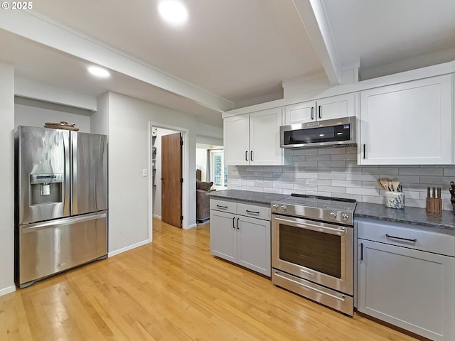 kitchen with stainless steel appliances, beam ceiling, light hardwood / wood-style flooring, backsplash, and white cabinets