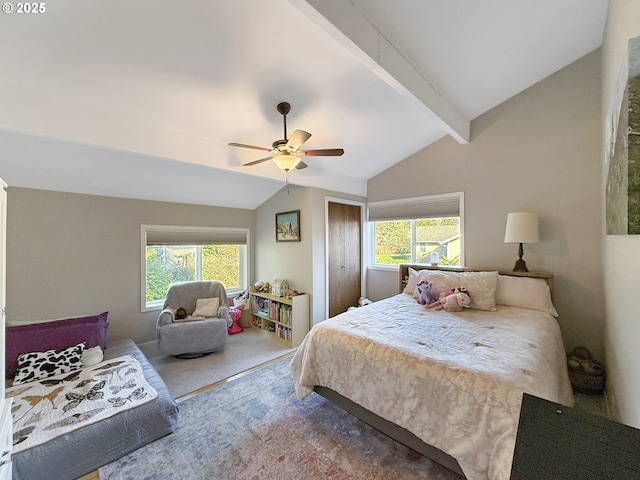 bedroom with ceiling fan, carpet flooring, vaulted ceiling with beams, and multiple windows