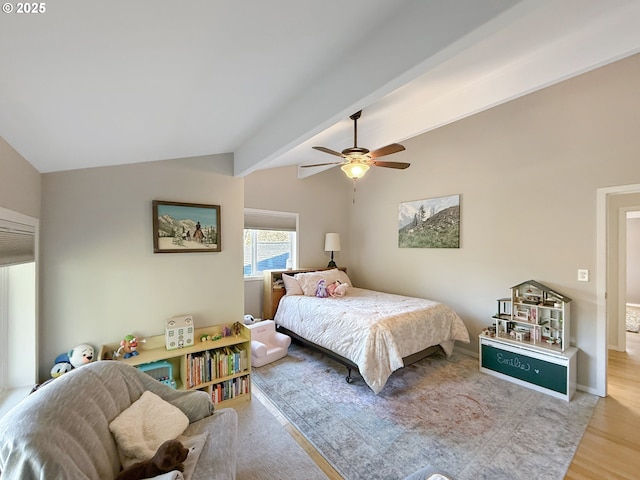 bedroom featuring ceiling fan, wood-type flooring, and lofted ceiling with beams