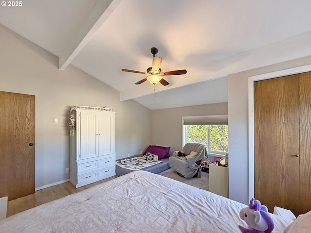 bedroom with vaulted ceiling with beams, ceiling fan, and wood-type flooring