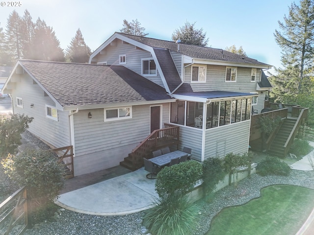 view of front of home featuring a patio area and a sunroom