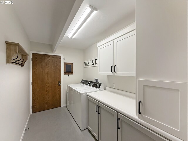 laundry area featuring cabinets and independent washer and dryer