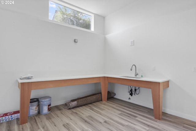 interior space featuring wood-type flooring and sink