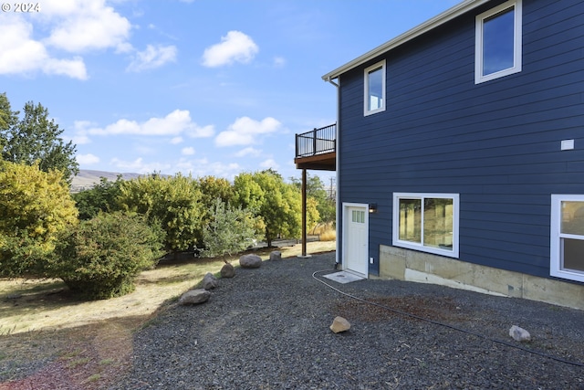 view of property exterior featuring a balcony