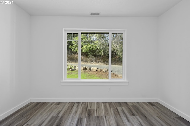 spare room featuring dark hardwood / wood-style floors