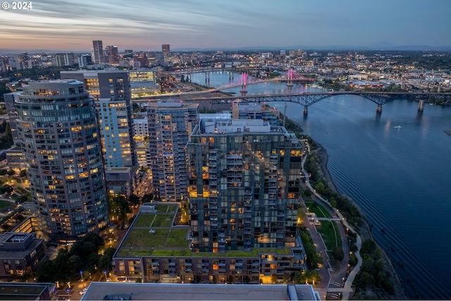 aerial view at dusk with a water view