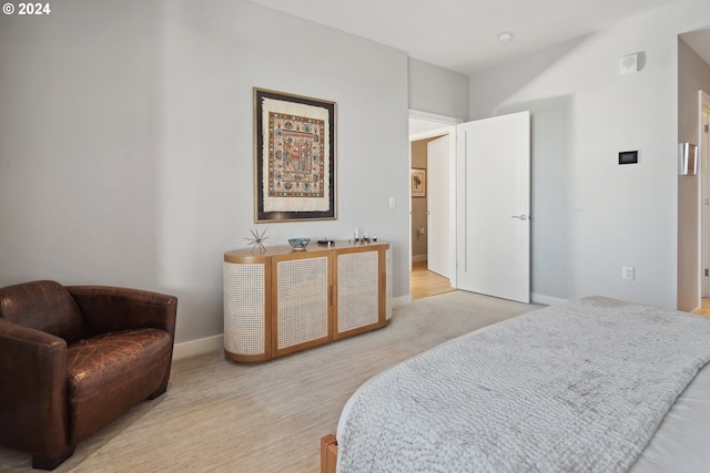 bedroom with light hardwood / wood-style floors